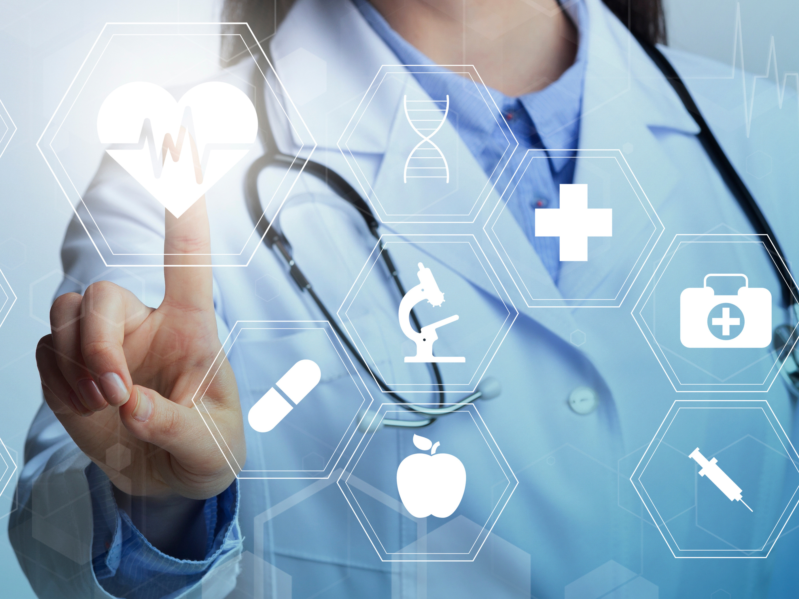 a doctor pointing to science based  icons on a screen